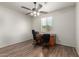Bright office space with hardwood floors, ceiling fan, and large window at 2993 E Meadowview Dr, Gilbert, AZ 85298