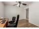 Cozy office space with hardwood floors, desk, chairs, and natural light at 2993 E Meadowview Dr, Gilbert, AZ 85298
