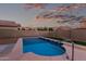 Private backyard pool highlighting the relaxing outdoor space with lush artificial turf at 2993 E Meadowview Dr, Gilbert, AZ 85298