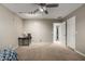 Bedroom featuring a ceiling fan, carpet floors, neutral colored walls, and a closet at 30165 W Flower St, Buckeye, AZ 85396