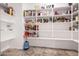 Pantry with open shelving stocked with a variety of non-perishable food items at 30165 W Flower St, Buckeye, AZ 85396