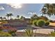 Well-maintained Tartesso Community Park entrance sign with lush greenery and landscaping at 30165 W Flower St, Buckeye, AZ 85396