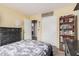 Bright bedroom with a dark wood dresser, a ceiling fan, and access to the en-suite bathroom at 30259 N Sunray Dr, San Tan Valley, AZ 85143