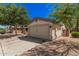 Single-Gathering home with two-car garage, desert landscaping and a fenced dog run on the side at 30259 N Sunray Dr, San Tan Valley, AZ 85143