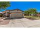 This charming home features a desert landscaped yard and a two-car garage at 30259 N Sunray Dr, San Tan Valley, AZ 85143