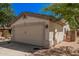 Side view of single-Gathering home featuring desert landscaping and a two-car garage at 30259 N Sunray Dr, San Tan Valley, AZ 85143