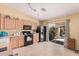 Bright kitchen with lots of natural light, tile floor, and sliding doors leading to the backyard at 30259 N Sunray Dr, San Tan Valley, AZ 85143