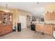 Large kitchen featuring tile flooring, light cabinets, closet, and ample countertop space at 30259 N Sunray Dr, San Tan Valley, AZ 85143