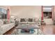 Cozy living room featuring plush sofas, decorative pillows, and stylish coffee table, perfect for relaxation at 30259 N Sunray Dr, San Tan Valley, AZ 85143