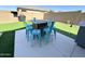 Cozy backyard patio with a fire pit table and chairs, perfect for outdoor relaxation and entertainment at 322 S Soledad Ct, Casa Grande, AZ 85194