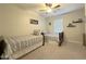 Shared bedroom with two twin beds, natural light and golf decor, providing a shared space at 322 S Soledad Ct, Casa Grande, AZ 85194