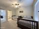 A neutral bedroom features two beds and an ensuite bathroom with light carpet at 322 S Soledad Ct, Casa Grande, AZ 85194