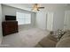 Comfortable bedroom featuring cozy sofa, dresser and carpet for a relaxing atmosphere at 322 S Soledad Ct, Casa Grande, AZ 85194
