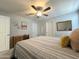 Bright bedroom features a ceiling fan, artwork, and furnishings, creating a relaxing atmosphere at 322 S Soledad Ct, Casa Grande, AZ 85194