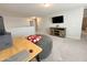Bonus room provides an inviting space for leisure, complete with a TV and neutral carpet at 322 S Soledad Ct, Casa Grande, AZ 85194