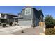 Stylish two-story home featuring a gray exterior, well-manicured landscaping, and a spacious driveway at 322 S Soledad Ct, Casa Grande, AZ 85194