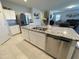 Open kitchen featuring an island, stainless steel appliances, granite countertops, and white cabinetry at 322 S Soledad Ct, Casa Grande, AZ 85194