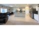 Open-concept kitchen with stainless appliances and a dining area, creating a great space for entertaining at 322 S Soledad Ct, Casa Grande, AZ 85194