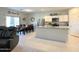 Open concept kitchen with center island and dining area, featuring white cabinets at 322 S Soledad Ct, Casa Grande, AZ 85194