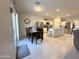 Bright, open-concept kitchen and dining area with modern stainless steel appliances and a central island at 322 S Soledad Ct, Casa Grande, AZ 85194