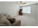 Cozy living room features a comfortable sofa and natural light, creating an inviting atmosphere at 322 S Soledad Ct, Casa Grande, AZ 85194