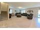 Expansive living room with plush seating, neutral tones, and ample space for entertaining at 322 S Soledad Ct, Casa Grande, AZ 85194