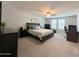 Relaxing main bedroom with carpet, a ceiling fan, and ample natural light from the window at 322 S Soledad Ct, Casa Grande, AZ 85194