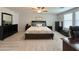 Relaxing main bedroom with carpet, a ceiling fan, and ample natural light from the window at 322 S Soledad Ct, Casa Grande, AZ 85194