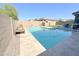 Beautiful backyard pool with lounge chairs and well manicured landscaping at 322 S Soledad Ct, Casa Grande, AZ 85194