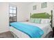 Bright bedroom with green accents, large window with natural light at 4221 S Fireside Ct, Gilbert, AZ 85297