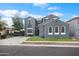Charming two-story home featuring a well-maintained front yard and a private driveway at 4221 S Fireside Ct, Gilbert, AZ 85297