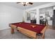 Game room features a wooden pool table and leads to the kitchen at 4221 S Fireside Ct, Gilbert, AZ 85297