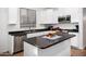 Bright kitchen with white cabinets, dark countertops, stainless appliances, and a center island at 4221 S Fireside Ct, Gilbert, AZ 85297
