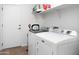 Laundry room with washer, dryer, shelving and door at 4221 S Fireside Ct, Gilbert, AZ 85297