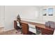 Office space with two desks, white chairs, and light-filled windows at 4221 S Fireside Ct, Gilbert, AZ 85297