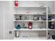 Walk-in pantry featuring adjustable shelving, with ample storage space at 4221 S Fireside Ct, Gilbert, AZ 85297