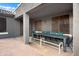 Covered outdoor patio with a long table, chairs, and benches, great for entertaining at 4221 S Fireside Ct, Gilbert, AZ 85297