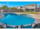 Sparkling swimming pool surrounded by a fenced yard and a sun deck at 4221 S Fireside Ct, Gilbert, AZ 85297
