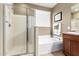 Well maintained bathroom featuring a shower, tub, and vanity with sink at 42519 W Centennial Ct, Maricopa, AZ 85138