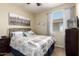 Bedroom featuring neutral walls, carpeted floors, and a window for natural light at 42519 W Centennial Ct, Maricopa, AZ 85138