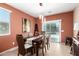 Cozy dining room featuring natural light, stylish furniture, and neutral tones at 42519 W Centennial Ct, Maricopa, AZ 85138