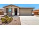 Charming single story home with a desert landscape and neutral color palette at 42519 W Centennial Ct, Maricopa, AZ 85138