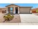 Charming single story home with a desert landscape and neutral color palette at 42519 W Centennial Ct, Maricopa, AZ 85138