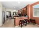 Spacious kitchen with stainless steel appliances, granite countertops and seating area at 42519 W Centennial Ct, Maricopa, AZ 85138