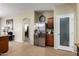 Open-concept kitchen featuring stainless steel appliances and tiled floors at 42519 W Centennial Ct, Maricopa, AZ 85138