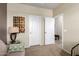 Inviting room with couch, art, and view of other rooms from doorway at 42519 W Centennial Ct, Maricopa, AZ 85138
