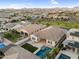 A captivating aerial view highlighting a backyard pool, patio, turf and outdoor lounge space at 4360 S Atom --, Mesa, AZ 85212