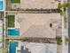 Aerial view of a well-maintained property with a pool, patio, artificial turf, and manicured landscaping at 4360 S Atom --, Mesa, AZ 85212