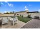 Great outdoor space with lounge furniture and landscaping near a stucco block fence at 4360 S Atom --, Mesa, AZ 85212