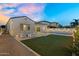 Expansive backyard with pool, patio, and artificial turf, ideal for relaxation and outdoor activities at 4360 S Atom --, Mesa, AZ 85212